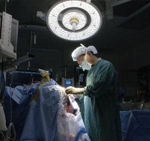 John Lee MD neurosurgeon performing surgery
